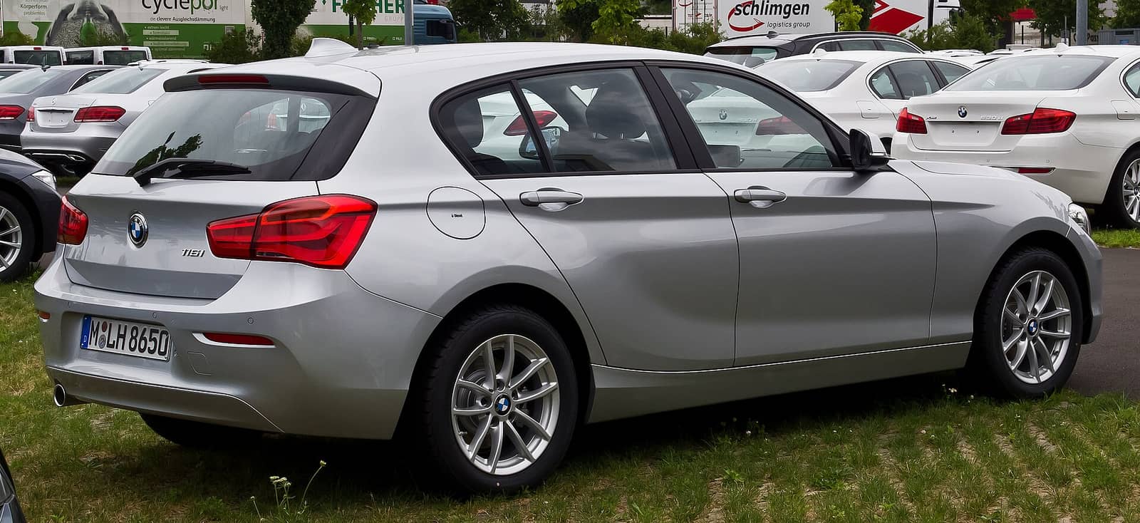 Silver BMW 116i, rear three-quarter view