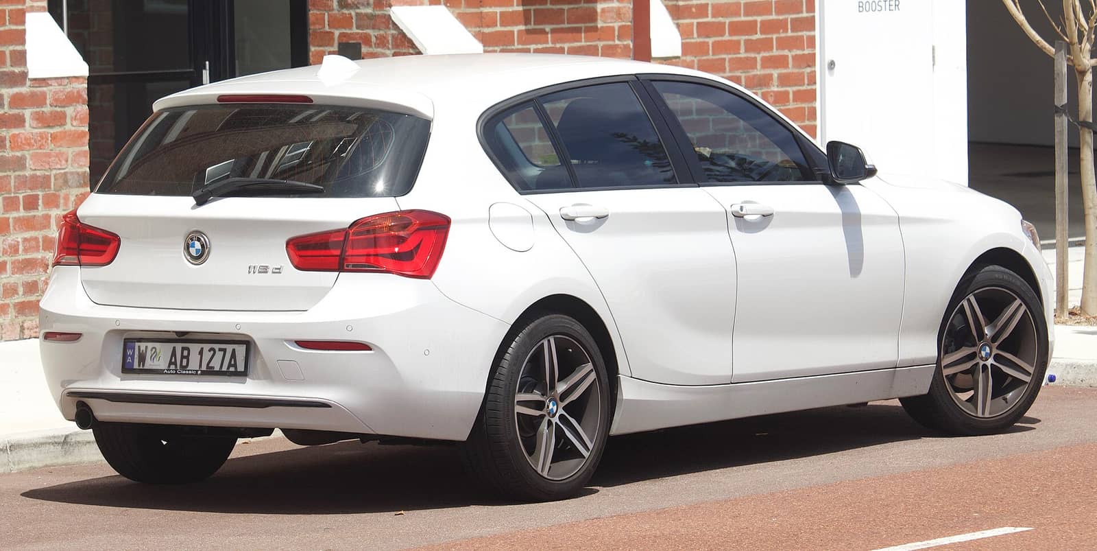 White BMW 118d, rear three-quarter view