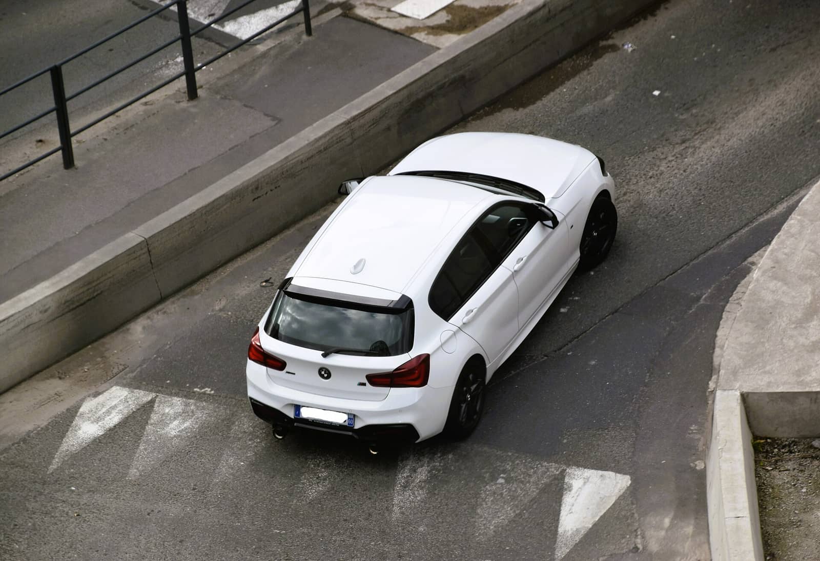 White BMW M140i xDrive seen from above, rear