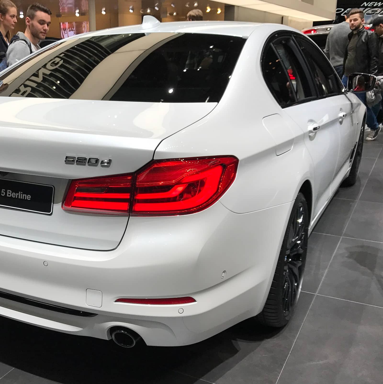 White BMW 520d tail light and rear badge